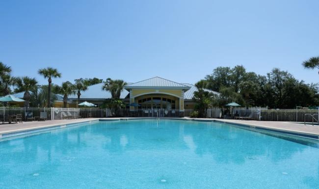 a swimming pool with a building in the background