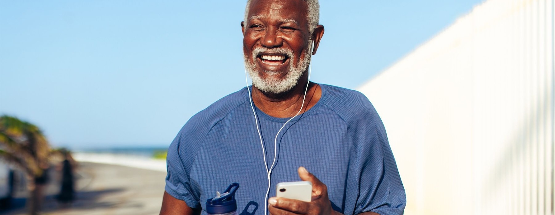 a man holding a water bottle while outdoors